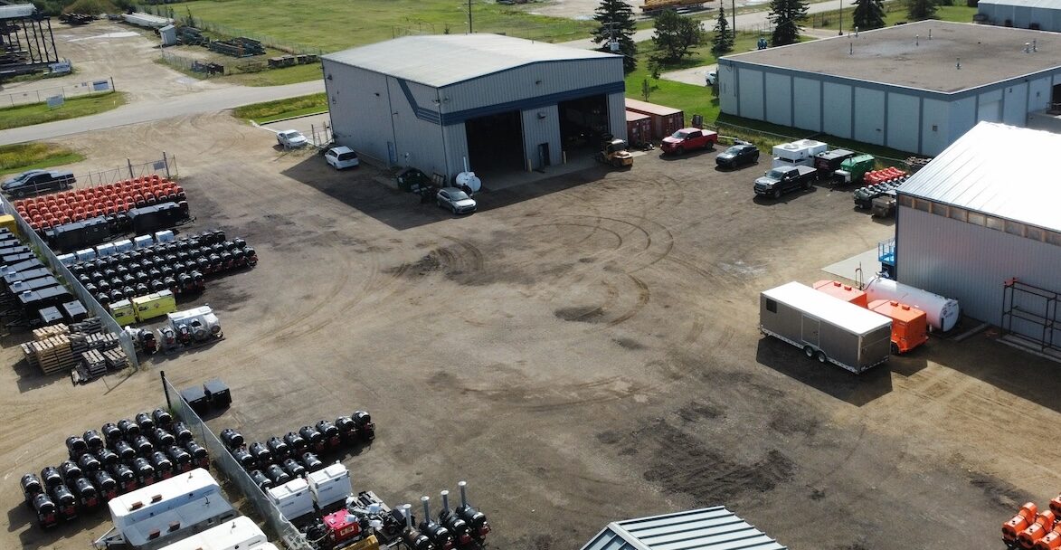 Aerial view of Heater Sales & Service's Nisku, Alberta facility, showing the main shop, yard, and visible inventory of heaters and equipment